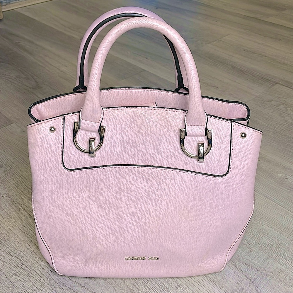 This Light pink Light  London Fog purse is very portable and lightweight.